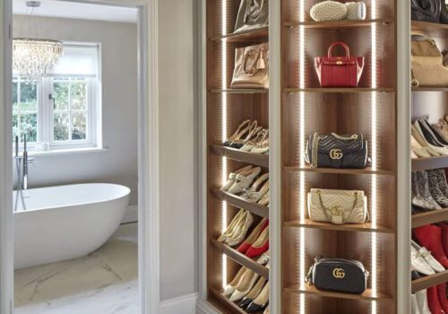 Rebecca Doyle's open walnut shoe and handbag storage. Rebecca Doyle's open walnut shoe and handbag storage.