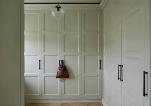 Sarah Llyod 11 Edwardian fitted wardrobe with handbag hanging on the black handles