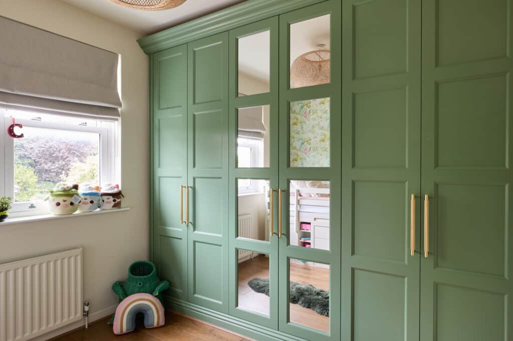 Edwardian style fitted wardrobes in green with mirrored doors