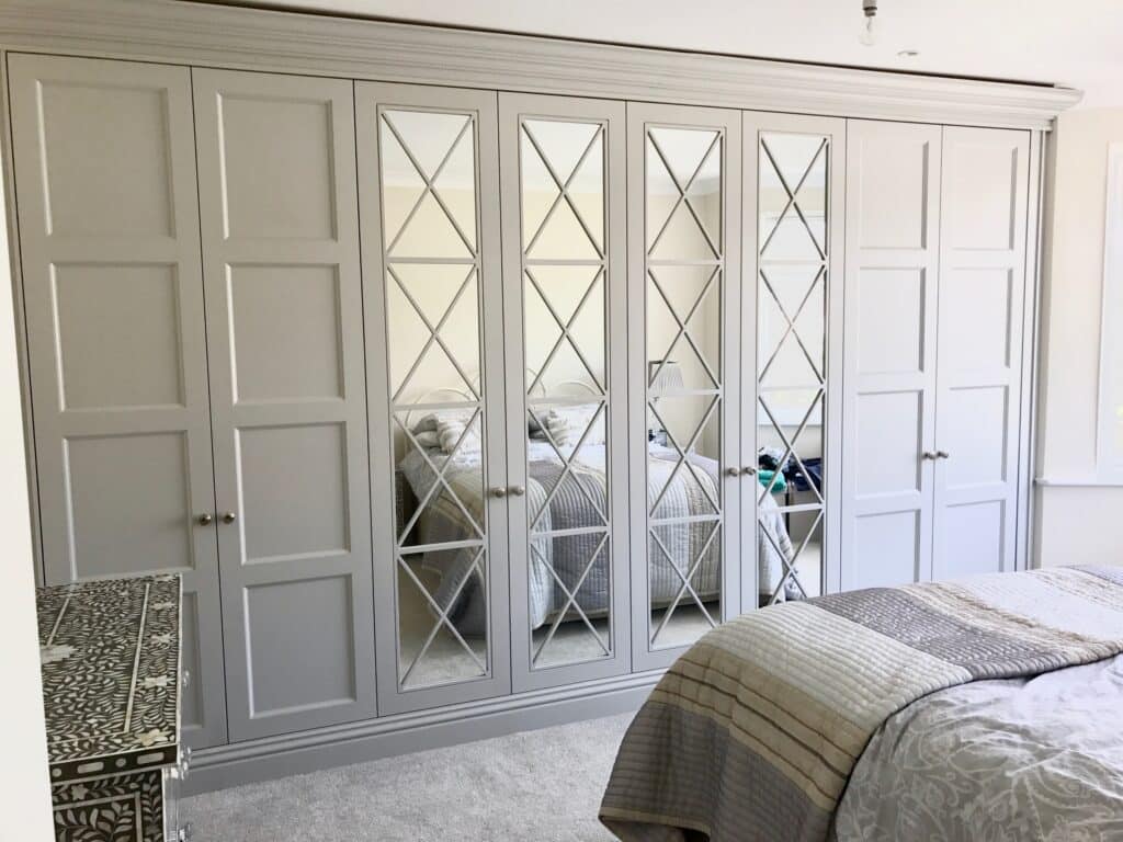 Richmond mirrored fitted wardrobes in bedroom in white