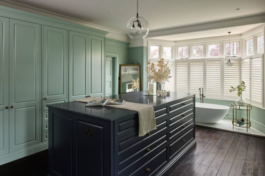 Jubilee fitted wardrobes with blue island in light green
