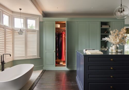 Tunbridge Wells - Emma 3 Jubilee fitted wardrobes with doors open and internal lighting. with island in blue