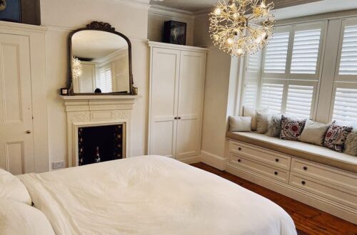 cb 1 White Tilford fitted wardrobes built around chimney and fireplace