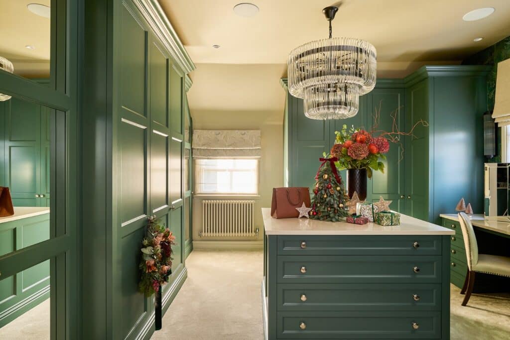 Heritage Wardrobes - Wall Hall4171-1620x1080 Bespoke Green Dressing Room with Christmas decorations on an island in the middle