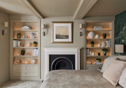 Heritage Wardrobes - Wall Hall4031-2160x1440 Matching Victorian style built-in shelving either side of fireplace in a bedroom - with dimmed light on