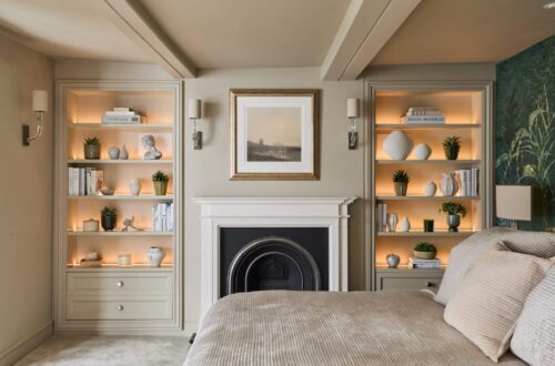 Heritage Wardrobes - Wall Hall4032-2160x1440 Matching Victorian style built-in shelving either side of fireplace in a bedroom - with light on