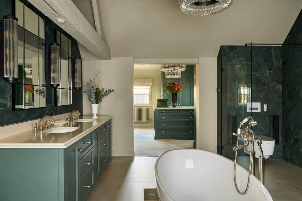 Heritage Wardrobes - Wall Hall4119-1620x1080 Fitted Wardrobes and hers sinks and bath tub in an ensuite bathroom, looking through to a custom built dressing room with island