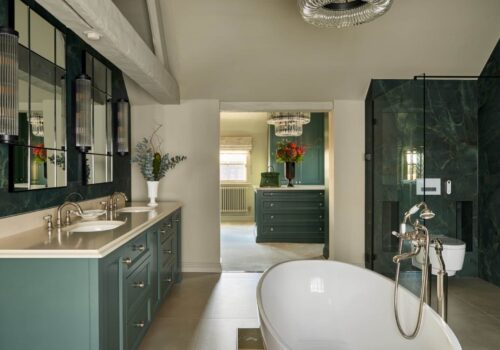 Heritage Wardrobes - Wall Hall4119-1620x1080 Fitted Wardrobes and hers sinks and bath tub in an ensuite bathroom, looking through to a custom built dressing room with island