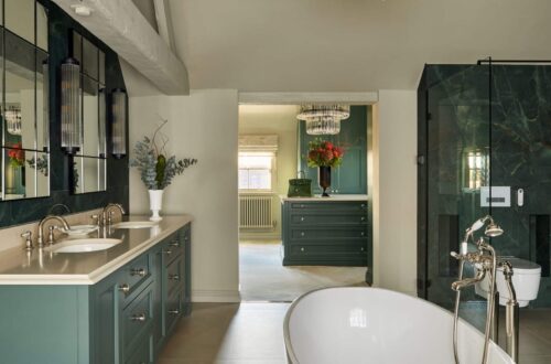 Heritage Wardrobes - Wall Hall4119-2560x1440 Fitted Wardrobes and hers sinks and bath tub in an ensuite bathroom, looking through to a custom built dressing room with island