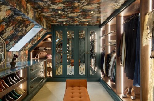 Heritage Wardrobe - Kings Rd 13 bespoke loft conversion into luxury dressing room. Including vibrant floral wallpaper, dark green wardrobes with mirrored doors and soft LED lighting